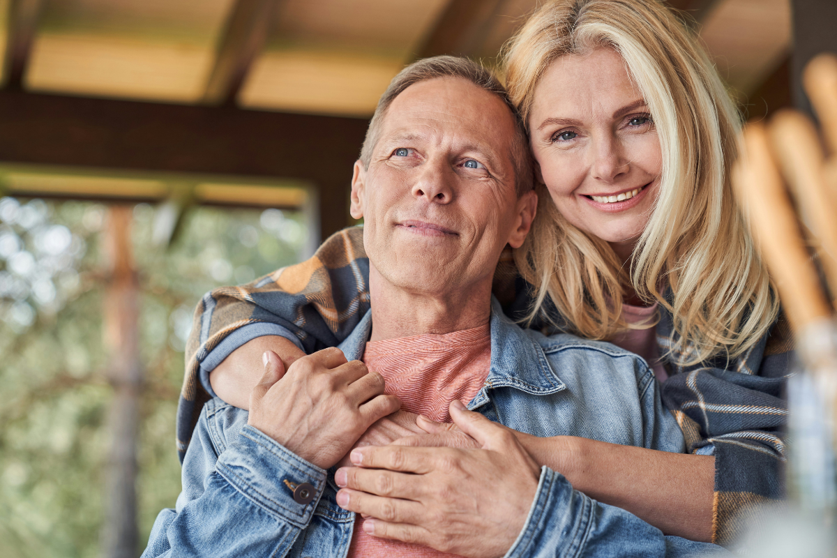 Senior couple relaxing outdoors together, representing peace of mind and confidence in retirement through personalized planning.